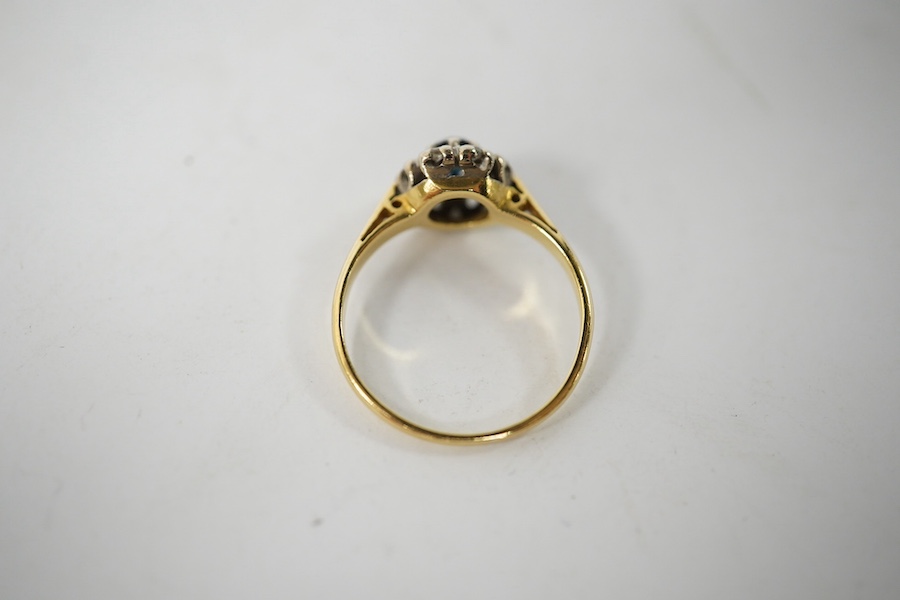 A small 18ct gold, sapphire and diamond set circular cluster ring, size J, gross weight 2.3 grams. Condition fair to good